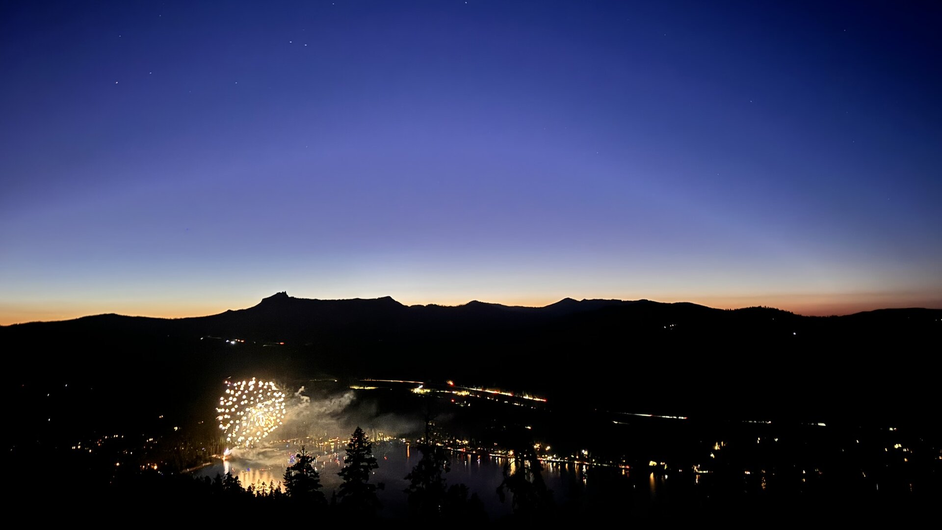 Fireworks over Donner Lake at dusk